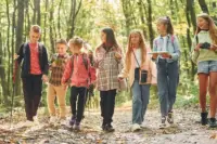 walking-together-kids-in-green-forest-at-summer-d-2021-12-23-00-47-43-utc_wp