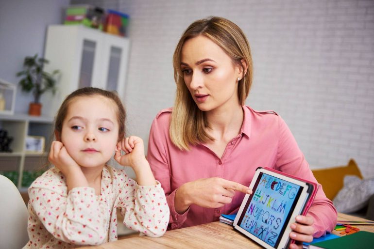 bored girl her mother studying with laptop home wp